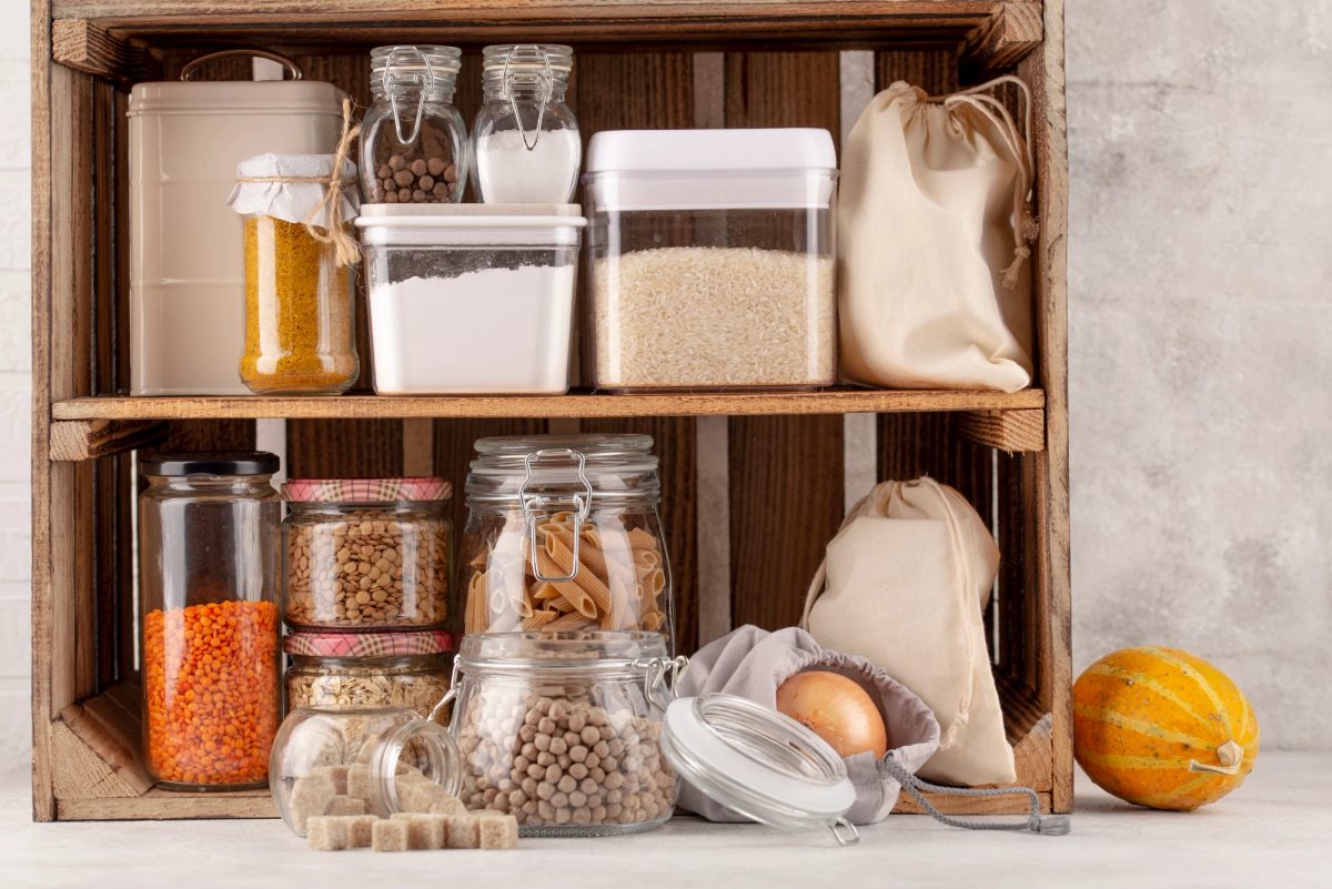 A small, tidy stock of ingredients and packed orders kept in a corner of an HDB flat